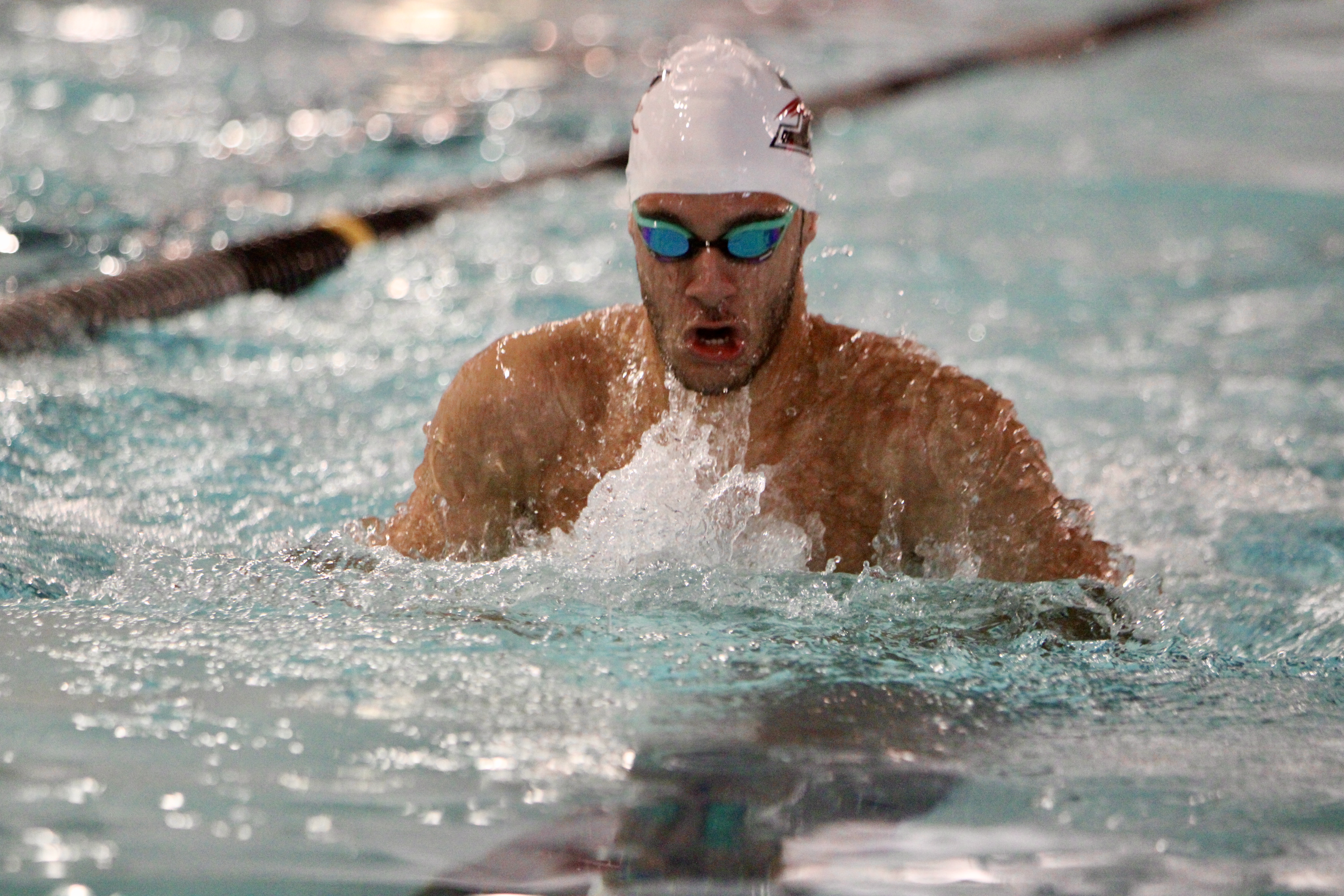 Mohammad swimming in competition
